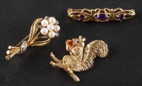 Three gemset brooches,