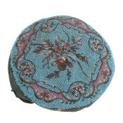 A Victorian beadwork seat cover: of circular outline,