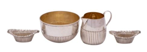 A Victorian silver sugar basin and matching cream jug, maker Holland, Son & Slater, London, 1881/83,
