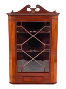 A Regency mahogany and glazed hanging corner cabinet, early 19th century,