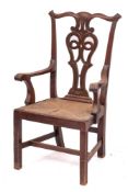 A mahogany and rush seated master's elbow chair in Chippendale style, last quarter 19th century,