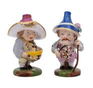 A pair of late 19th century French porcelain mansion house dwarfs: after the Derby originals,
