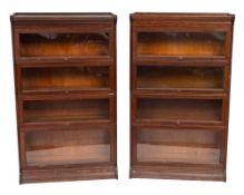 Two oak four section bookcases of Globe Wernicke type, early 20th century,