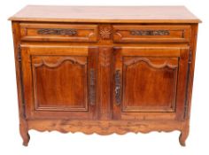 A Louis XV cherrywood buffet, circa 1770,: the top with ogee moulded edges,
