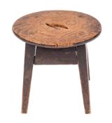 An elm and ebonised wood dairy stool, 18th / 19th century,