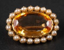 A 19th century, Imperial topaz and seed pearl brooch,: estimated topaz weight ca. 8.