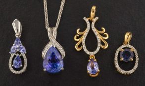 Four gemset pendants,: including a pear-shaped tanzanite and diamond pendant,