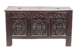 A Jacobean oak coffer, circa 1670 and later adapted,