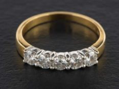 A round, brilliant-cut diamond, five-stone ring,: estimated total diamond weight ca. 0.