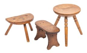 An ash milking stool, 18th / 19th century, the semi-circular seat with three straight,