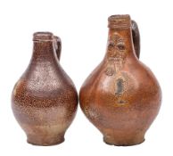 Two late 17th century German brown saltglaze stoneware Bellamine jugs: one with bearded mask to the