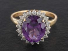 A 9ct gold amethyst and round, brilliant-cut diamond cluster ring,: estimated amethyst weight ca. 4.