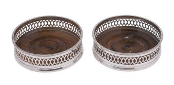 A pair of Elizabeth II silver wine coasters, maker C J Vander Ltd, London,