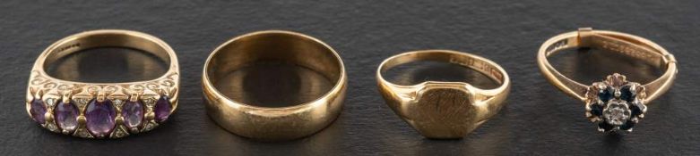 Four 9ct gold rings,