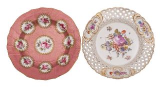 A Sevres-style soup plate and a Thuringian plate: the first painted with panels of pink rose sprays