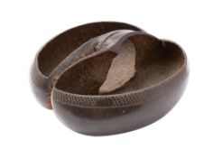 A coco-de-mer,: modelled as a cutlery tray or fruit basket, with incised criss-cross decoration,