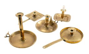 Five assorted late 18th and early 19th century brass chamber sticks: of varying designs and sizes.