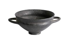 A South Italian blackware pottery bowl: with loop handles to the side of the tapering body, 11.