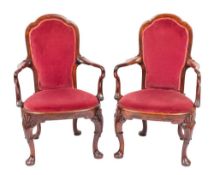 A pair of Anglo-Chinese carved and stained hardwood elbow chairs in George II taste,
