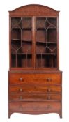 A Regency mahogany and line inlaid secretaire bookcase, circa 1815,