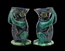 A pair of Longpark (Torquay) pottery grotesque ewers: each in the form of a frog-like creature