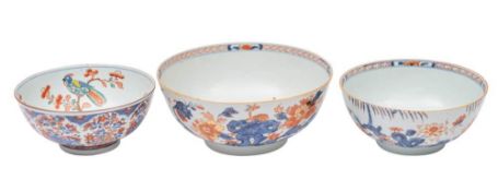 Two Chinese Imari bowls and one similar with Dutch clobbered decoration: the first two painted with