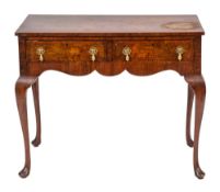 A walnut side table in George II style, 20th century,