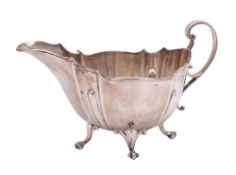An Edward VII silver sauce boat, maker Roberts & Belk Ltd, Sheffield 1904: of traditional design,