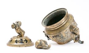 A large Chinese bronze incense burner and cover: the pierced domed cover surmounted by a temple dog,