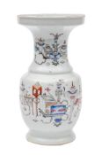 A Chinese famille rose 'auspicious objects' Gu vase: the body and neck painted with numerous