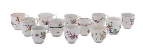 A group of twelve Bristol coffee cups: painted with floral sprays and garlands,