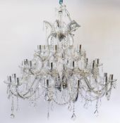 A contemporary cut glass three tier graduated twelve branch chandelier:,
