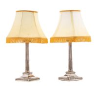 A pair of George III silver Ionic column candlesticks, maker I.