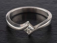 A palladium, princess-cut diamond ring,: estimated diamond weight ca. 0.