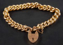 A curb-link bracelet with heart-shaped clasp,: the clasp stamped '15', length ca. 18.