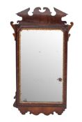 A walnut and parcel gilt framed rectangular wall mirror, elements 18th century and later,