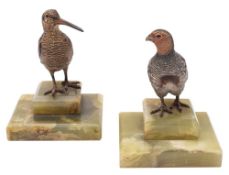 A pair of cold painted bronze paperweights in the form of birds: a snipe and a partridge mounted on