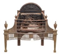 A polished steel and brass fire basket: of serpentine outline with arched back,