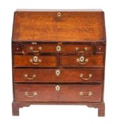 A George III oak bureau, circa 1770,