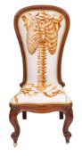 A Victorian mahogany and linen upholstered nursing chair, circa 1870,