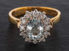 A 9ct gold, aquamarine and round brilliant-cut diamond cluster ring,
