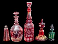 A mixed lot of Bohemian ruby and green glass: comprising a decorated green glass octagonal scent