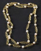 A cultured pearl necklace with twisted, openwork, fancy-link spacers,