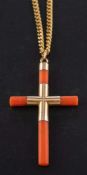A coral cruciform pendant,: with French control marks for 18ct gold,
