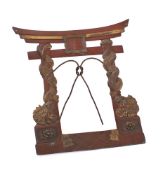 A Japanese bronzed metal photograph frame in the form of a Torii (Temple gate): decorated with