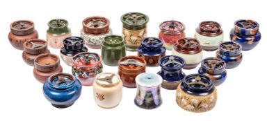 A group of twenty two pottery tobacco jars: various makers and decoration.