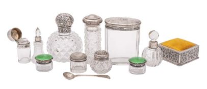 A group of ten glass and silver mounted dressing table bottles,