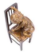 Juan Clara Ayats (1875-1958) Climbing Down: a bronze figure group of a young girl climbing off a