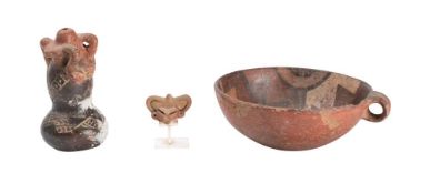 A Pre-Columbian pottery bowl: with geometric design decoration to the inner bowl and loop handle to