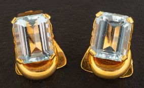 A pair of octagonal, step-cut aquamarine ear clips,: estimated total aquamarine weight ca. 7.